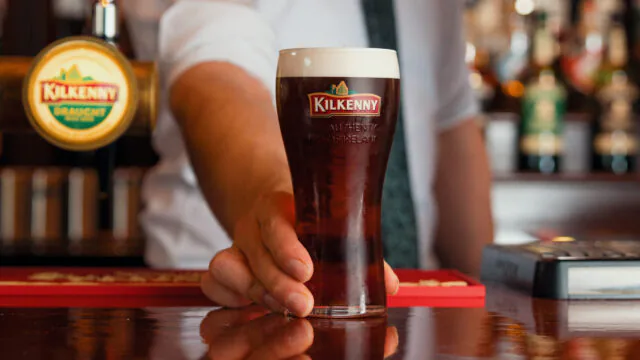 Pint of Kilkenny beer served at bar in Kilkenny Hibernian Hotel